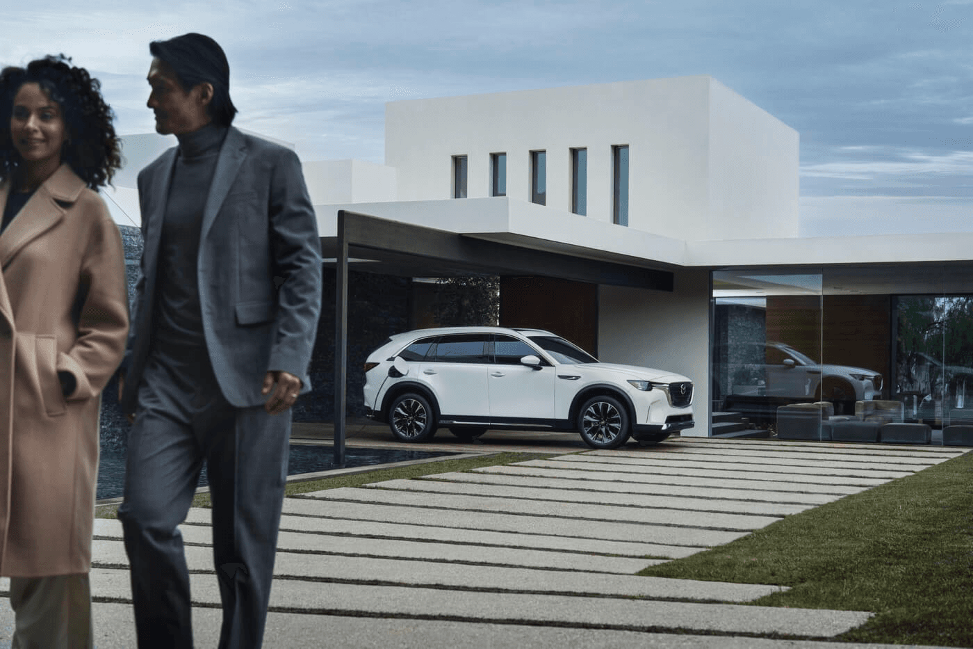 A remote couple from the 2025 Mazda CX-90 PHEV.